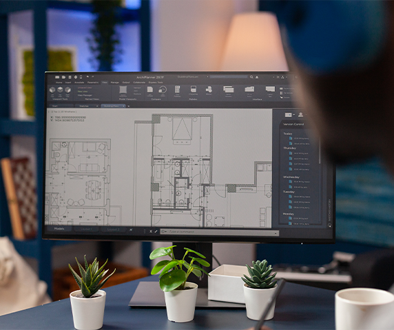 Professional architecture services plans on a computer